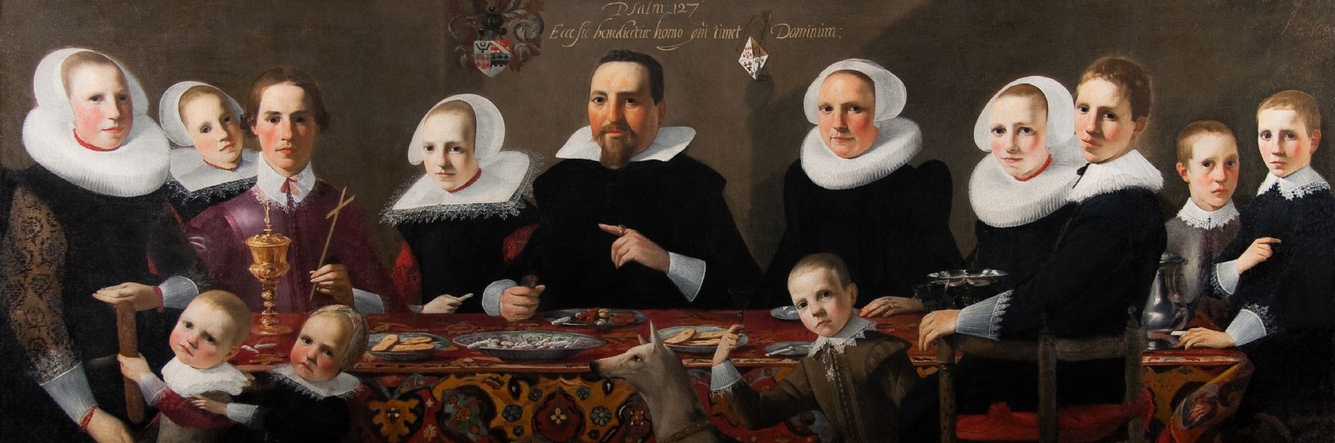 Familie portret uit 1628, iedereen zwart gekleed, met grote witte kragen 